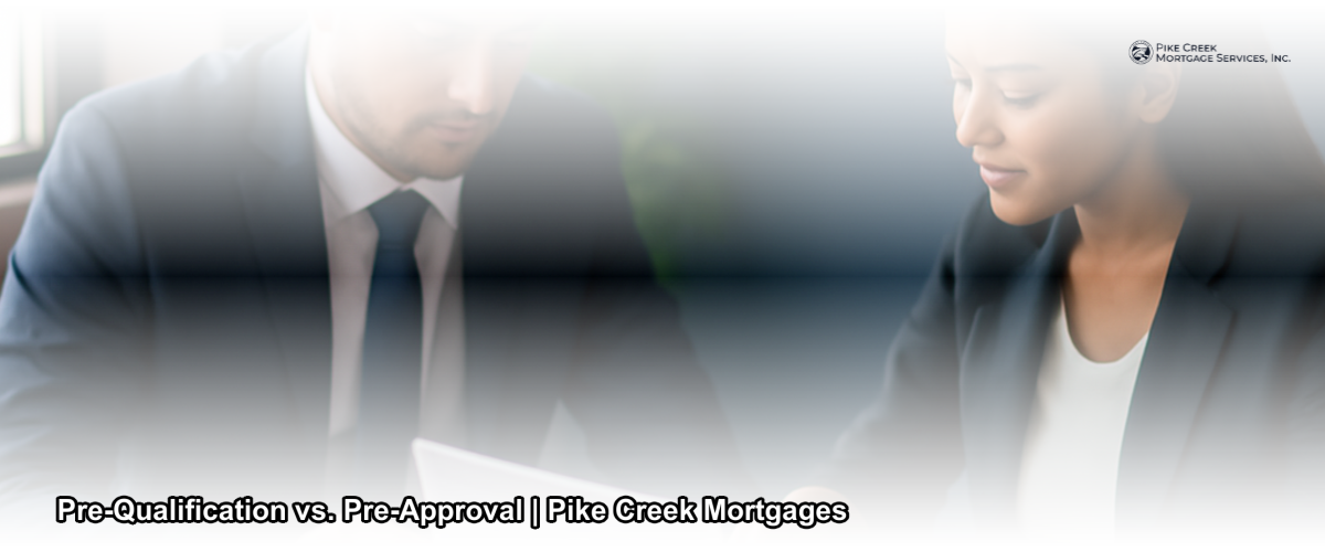 A homebuyer reviewing mortgage documents at a desk with a lender in Newark Delaware