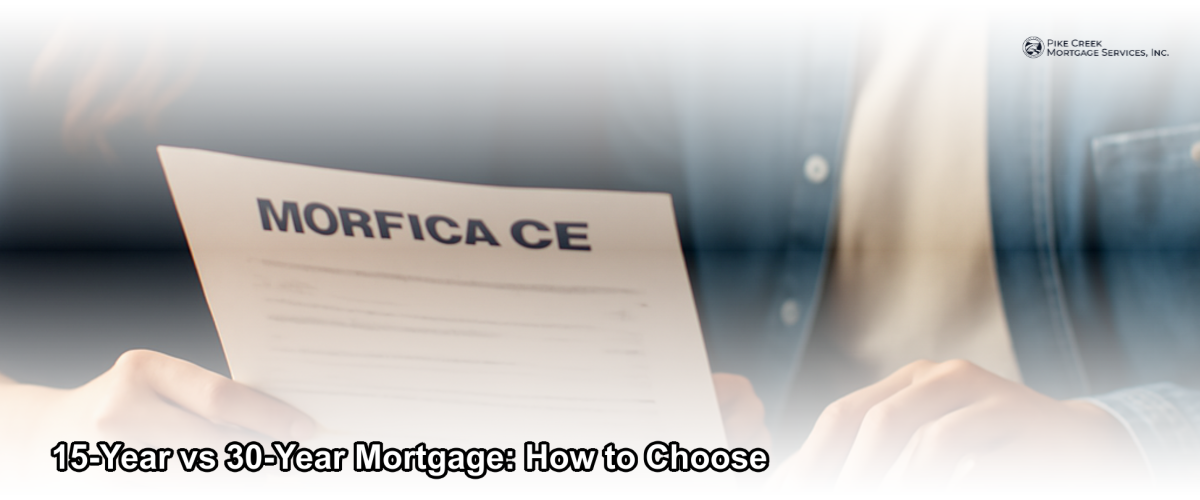A couple reviewing mortgage documents at a kitchen table with a calculator and home blueprints nearby, warm natural lighting