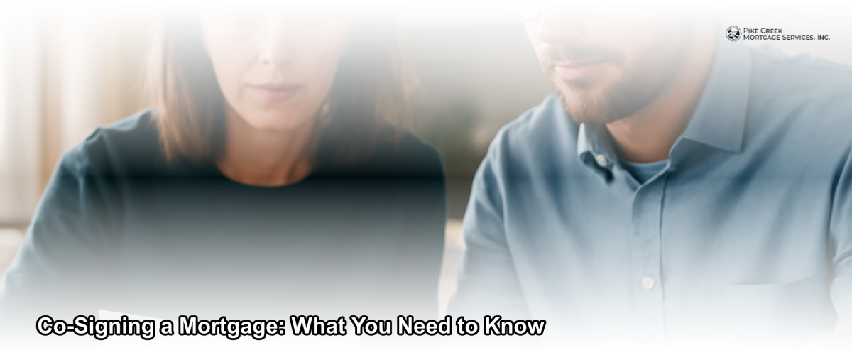 Two people reviewing mortgage documents together at a kitchen table in a bright Delaware home