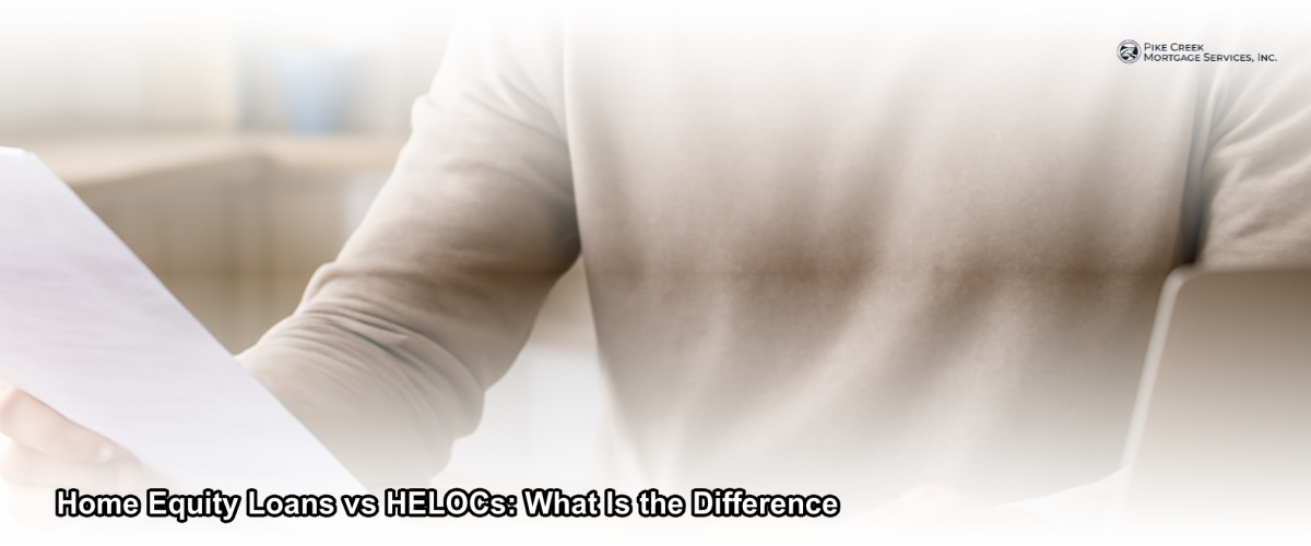 Homeowner reviewing home equity loan and HELOC documents at a kitchen table in a modern Delaware home
