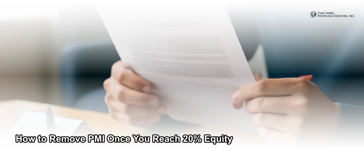 Homeowner reviewing mortgage documents at a desk, representing the process of canceling private mortgage insurance after reaching 20% home equity