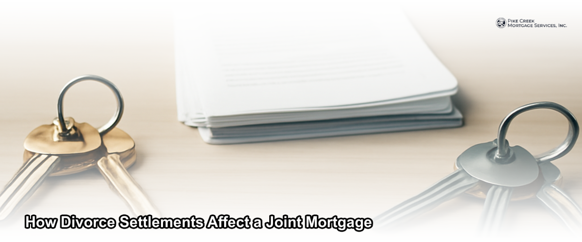 Two sets of house keys on a wooden table with legal documents and a pen, representing a divorce mortgage settlement