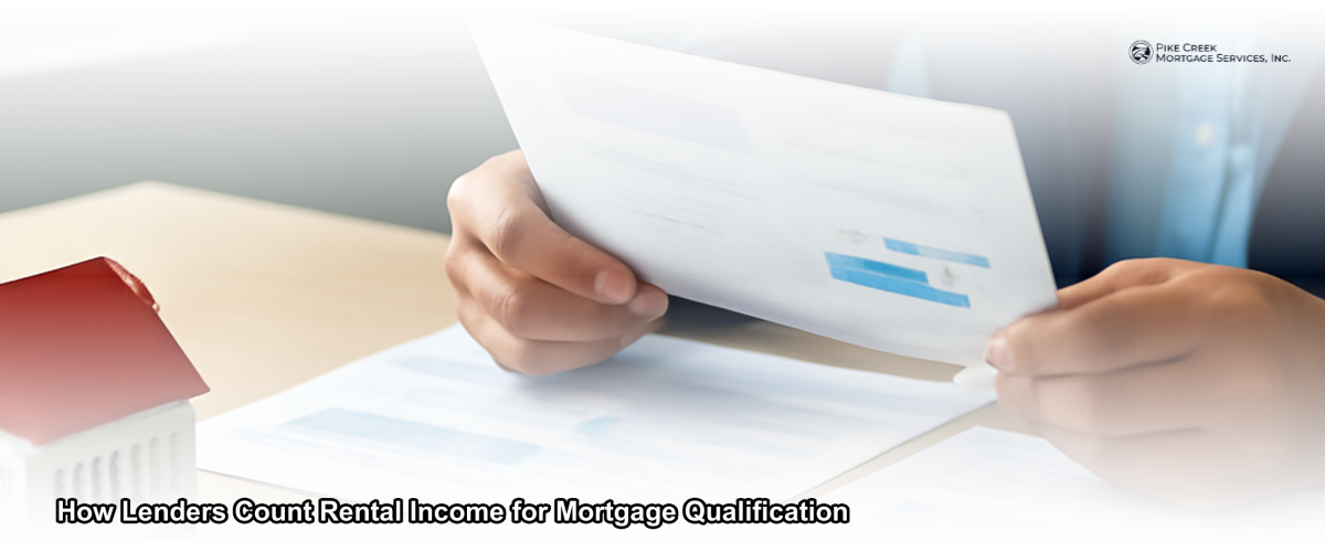 A mortgage lender reviewing rental property income documents at a desk in Newark Delaware
