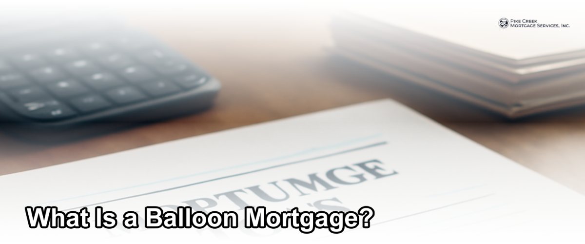 A close-up of a mortgage document with a pen and calculator on a desk, representing balloon mortgage planning
