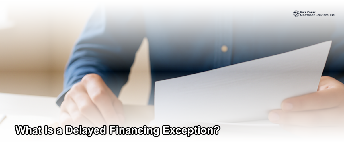 A homeowner reviewing mortgage documents at a desk with a new house key beside them, representing delayed financing after a cash purchase.